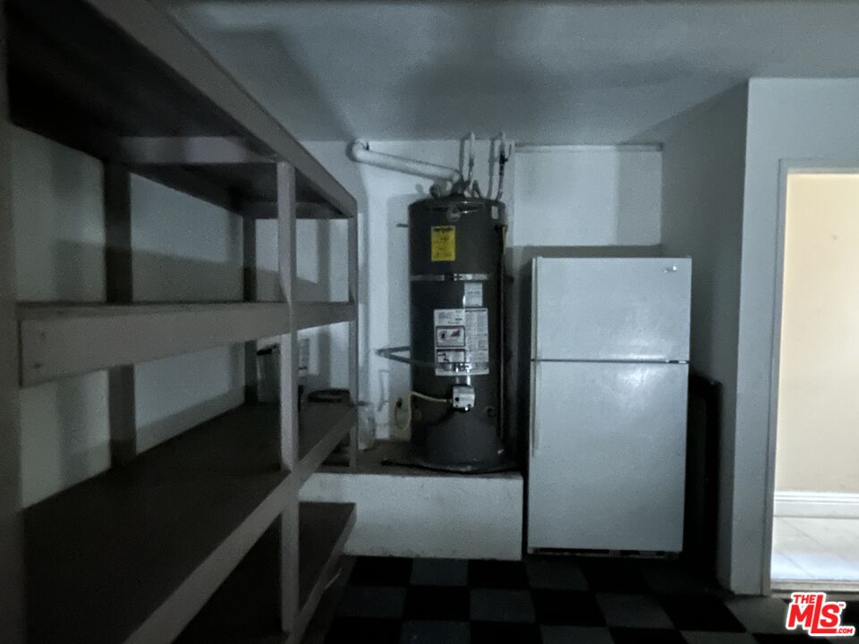 7430 Corbin Avenue, Unit 33 Reseda, CA 91335 - Photo 24 of 28 a kitchen with stainless steel appliances a refrigerator and a stove