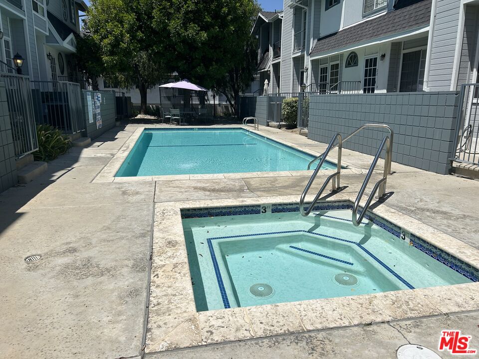 7430 Corbin Avenue, Unit 33 Reseda, CA 91335 - Photo 27 of 28 a view of backyard with a patio