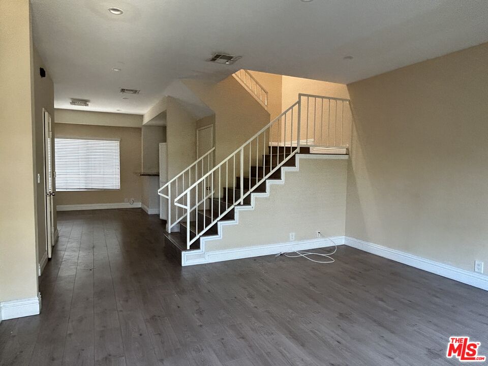 7430 Corbin Avenue, Unit 33 Reseda, CA 91335 - Photo 5 of 28 a view of entryway and hall with wooden floor