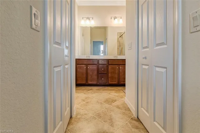 a bathroom with a vanity and a mirror
