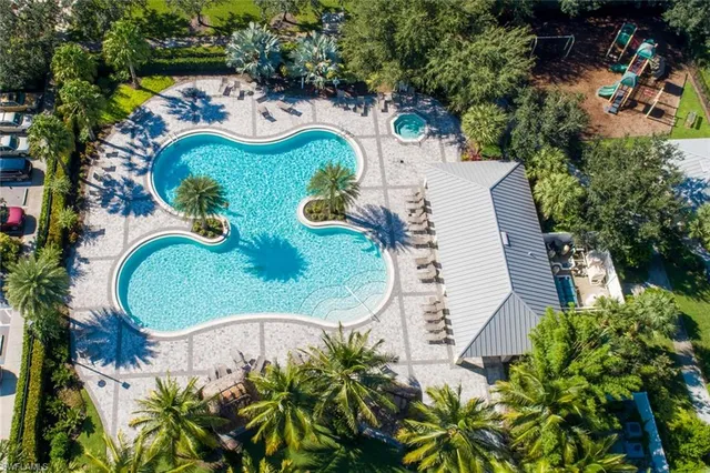 an aerial view of a swimming pool and outdoor space