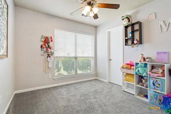 a bedroom with a bed and a tv in it