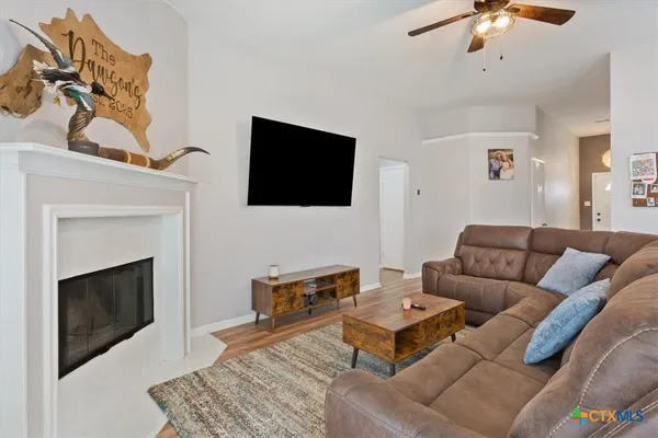 a living room with furniture and a large window