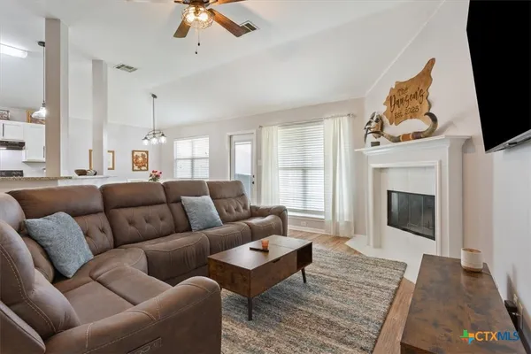 a dining room with furniture and window