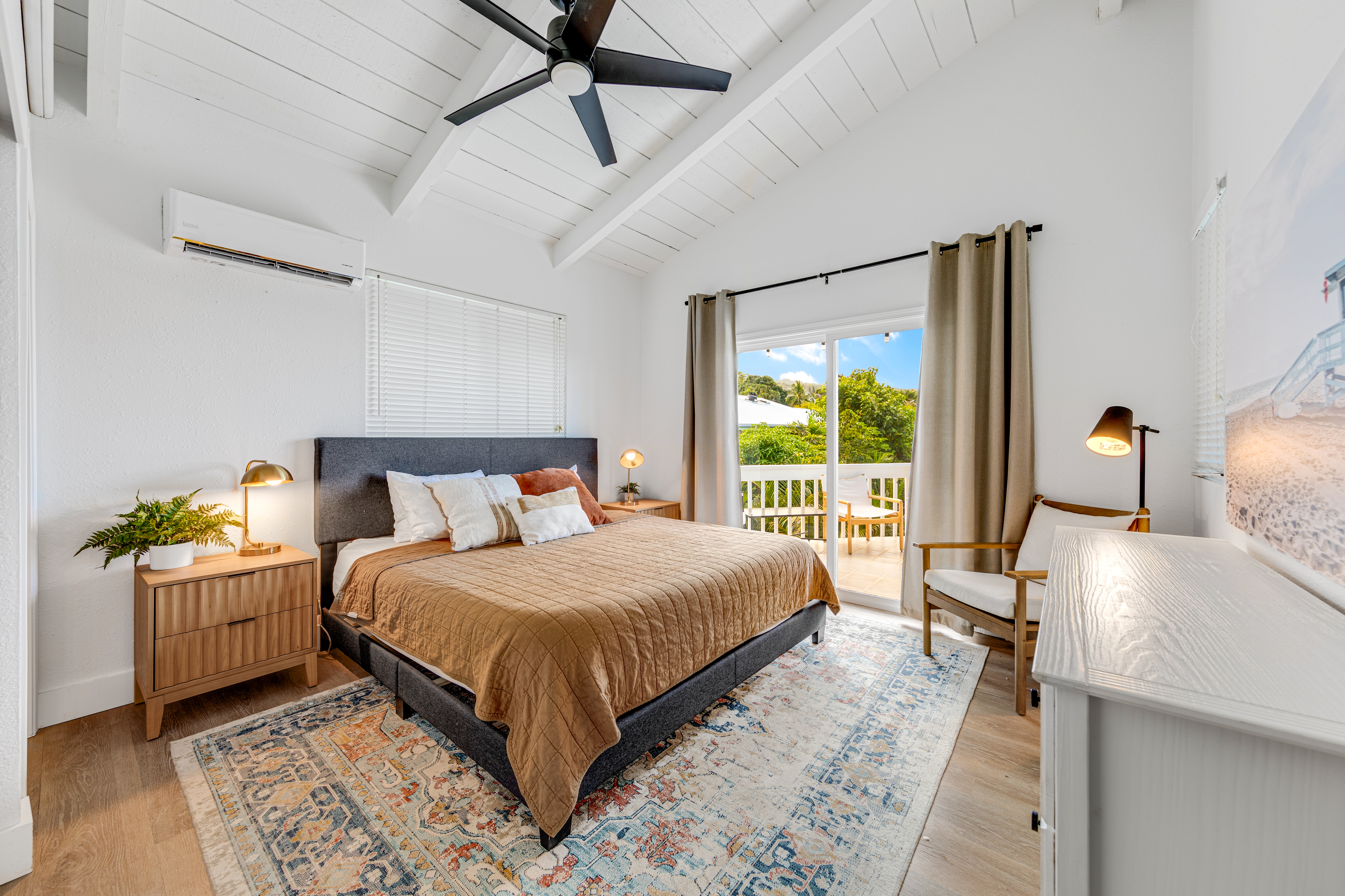 766122 A Royal Poinciana Way, Unit 2 Kailua-Kona, HI 96740 - Photo 16 of 24 a bedroom with a bed and window