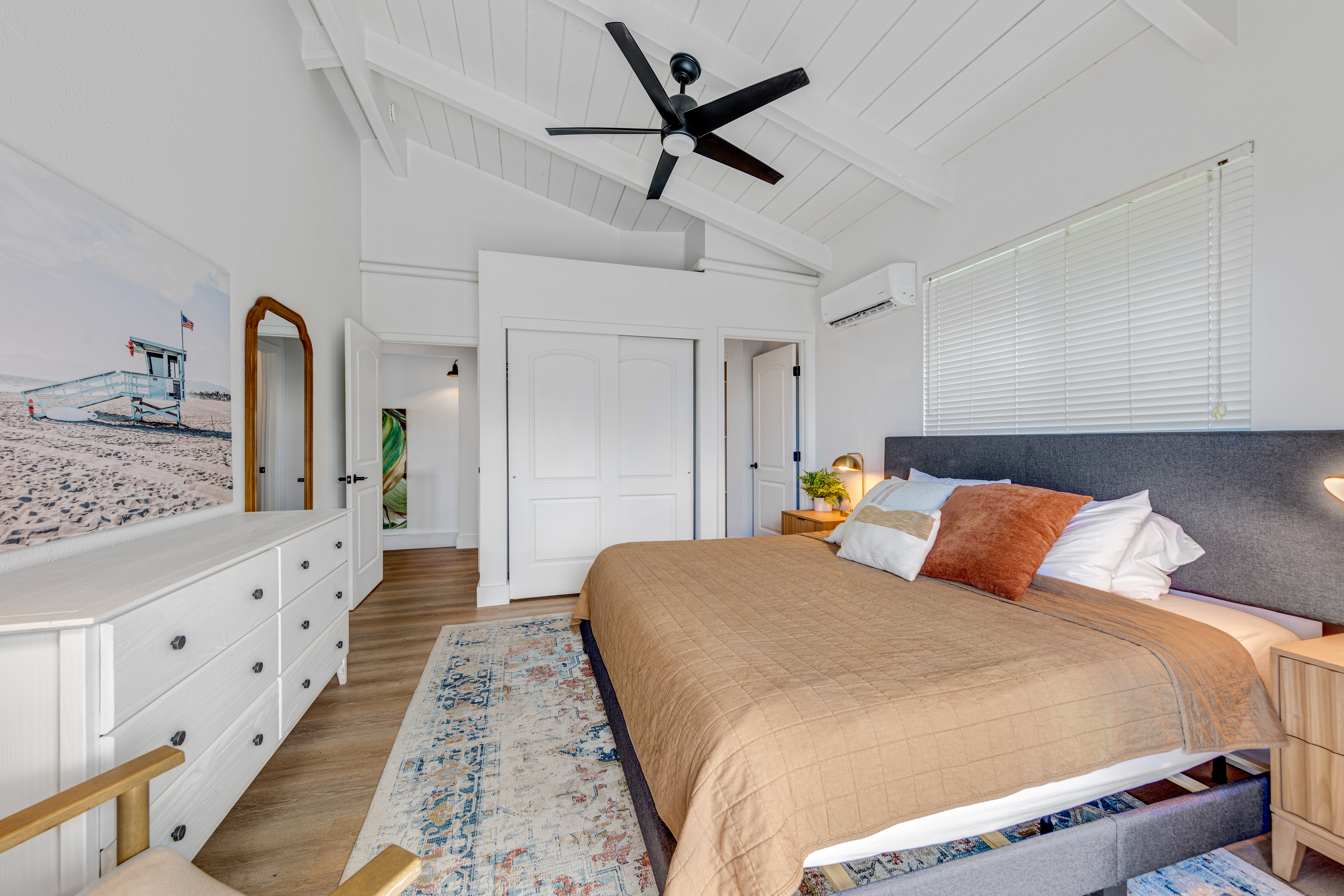 766122 A Royal Poinciana Way, Unit 2 Kailua-Kona, HI 96740 - Photo 17 of 24 a bedroom with a bed and wooden floor