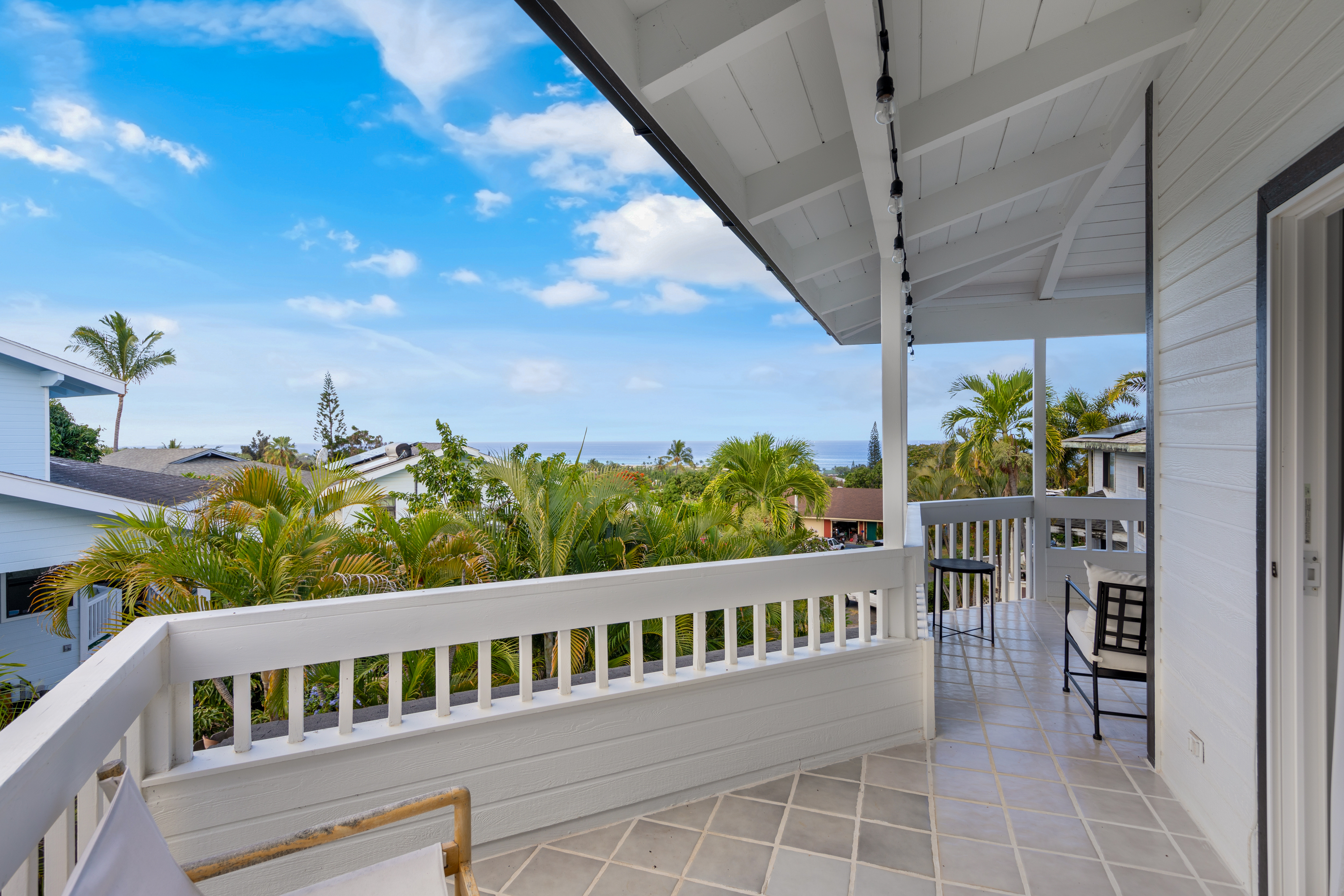 766122 A Royal Poinciana Way, Unit 2 Kailua-Kona, HI 96740 - Photo 18 of 24 a view of a balcony with outdoor seating