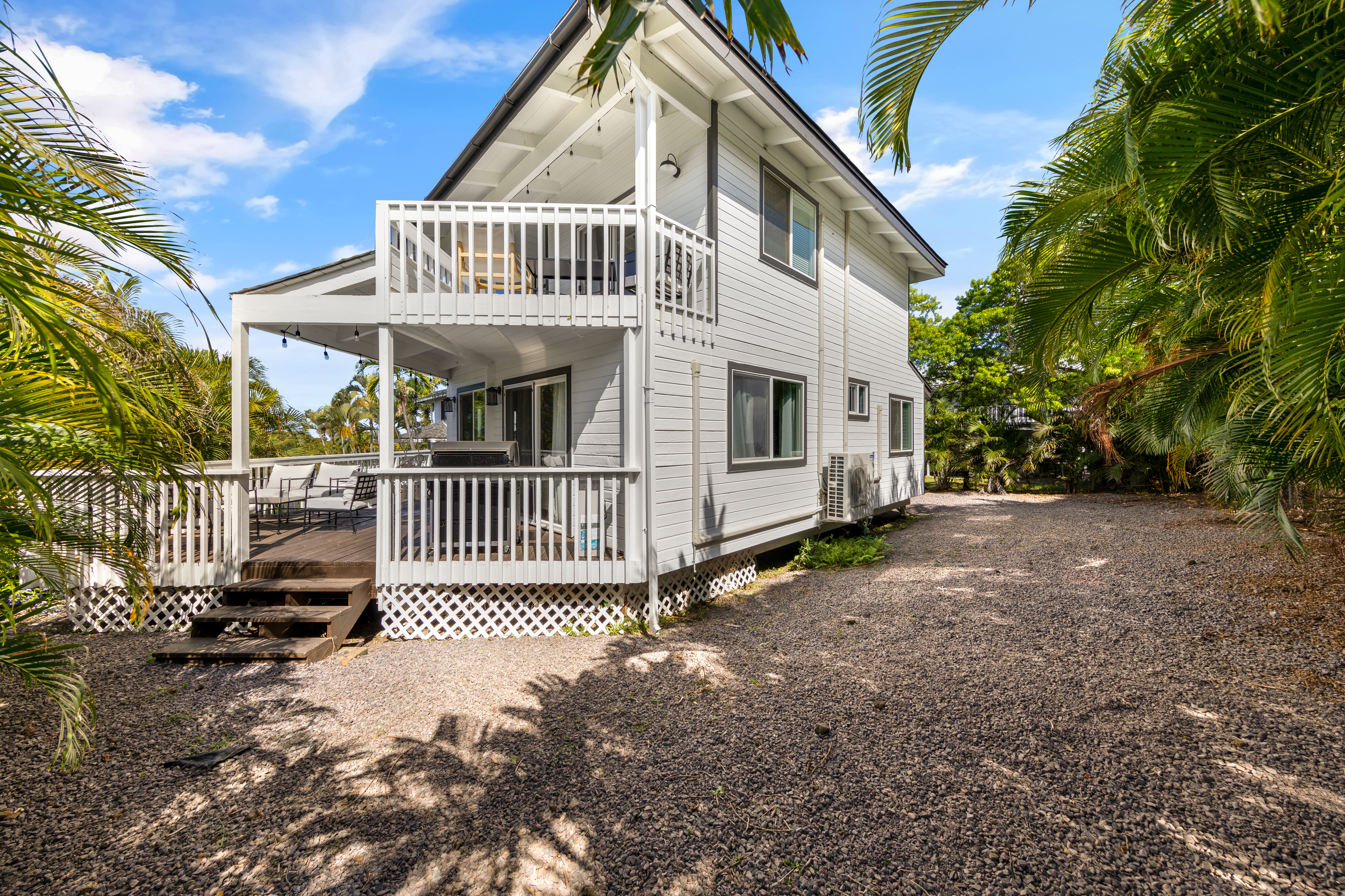 766122 A Royal Poinciana Way, Unit 2 Kailua-Kona, HI 96740 - Photo 23 of 24 a view of a house with a yard