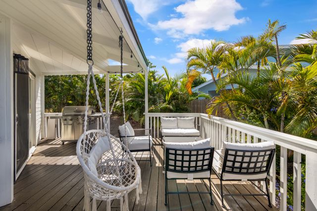 a view of a balcony with wooden floor