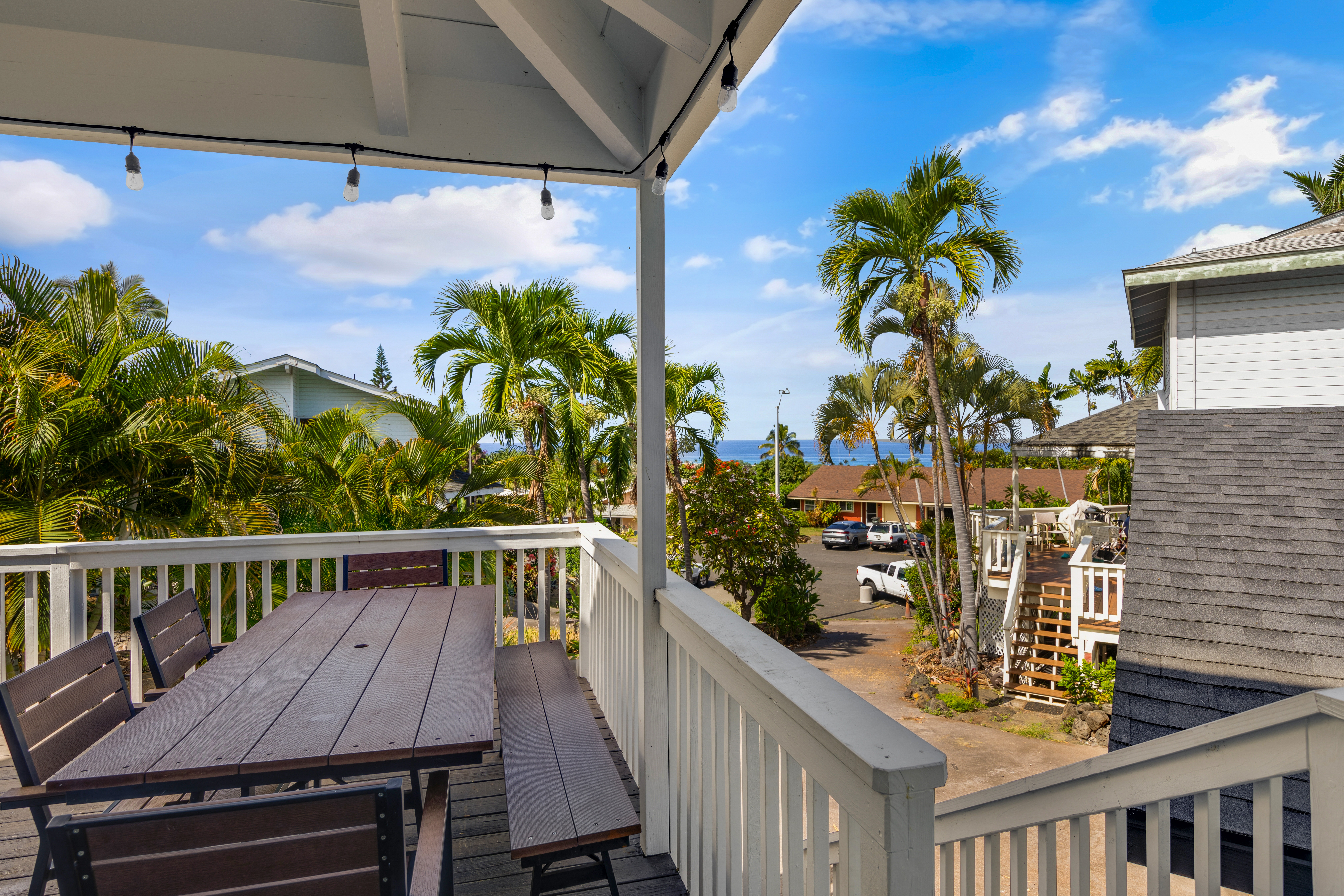 766122 A Royal Poinciana Way, Unit 2 Kailua-Kona, HI 96740 - Photo 4 of 24 a view of a balcony with wooden floor