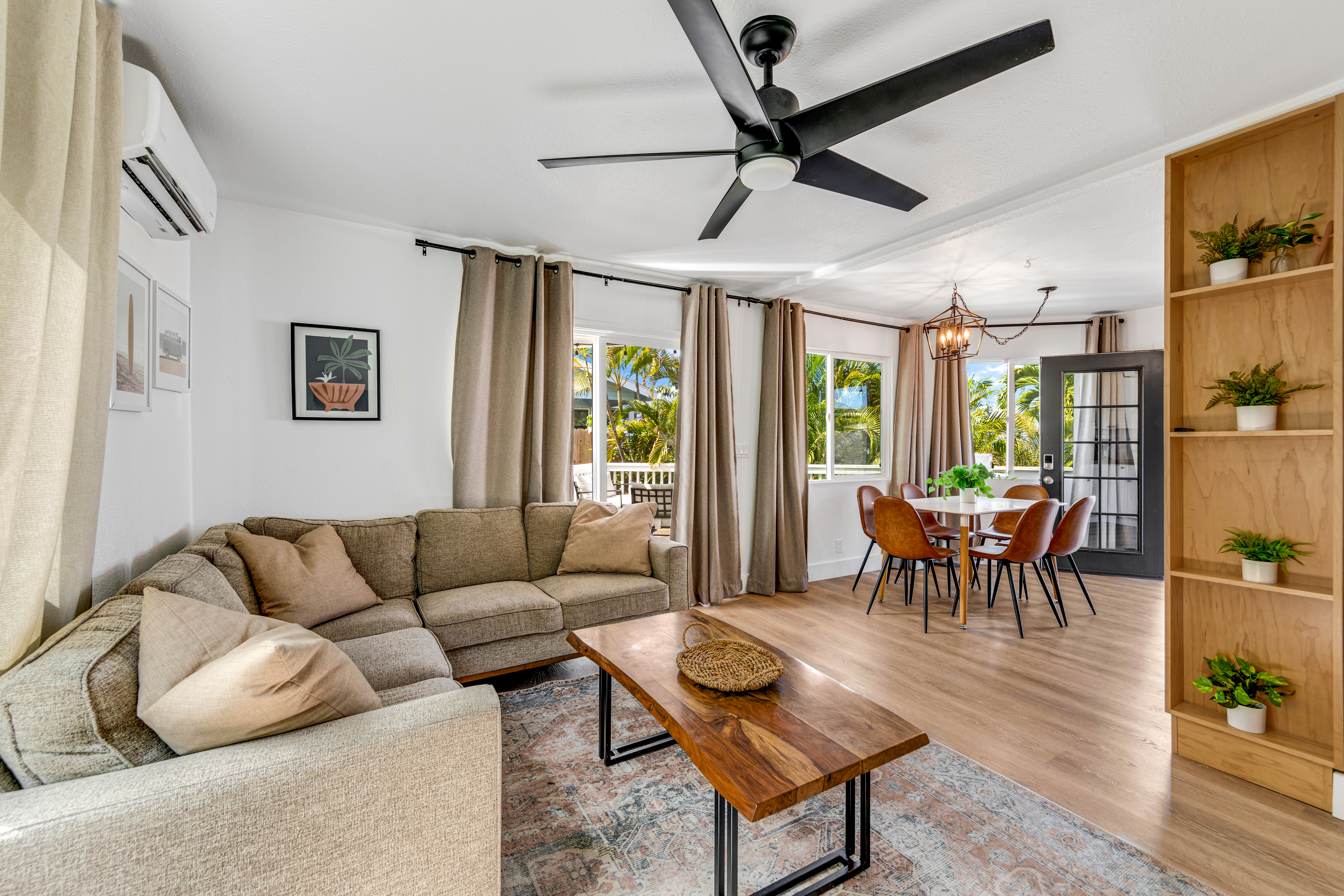 766122 A Royal Poinciana Way, Unit 2 Kailua-Kona, HI 96740 - Photo 10 of 24 a living room with furniture a ceiling fan and a window