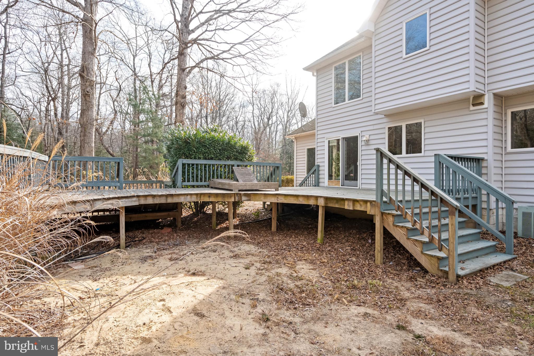 18885 Sand Hill Road Milton, DE 19968 - Photo 38 of 46 a backyard of a house with table and chairs