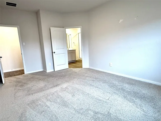 a view of two chairs in the patio