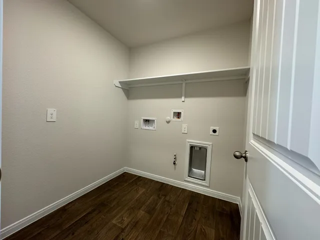 a view of a bathroom with wooden floor