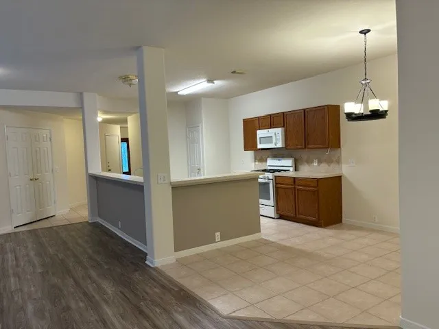 a kitchen with stainless steel appliances a sink and a refrigerator