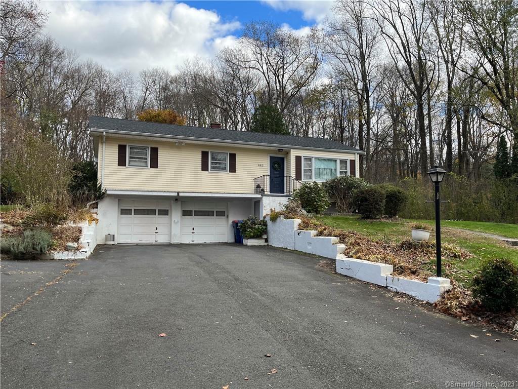 460 Moose Hill Road Monroe, CT 06468 - Photo 1 of 1 a view of a house with a yard and large trees