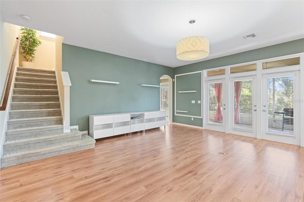 6799 Helmsley Circle Windermere, FL 34786 - Photo 14 of 61 an empty room with wooden floor and windows