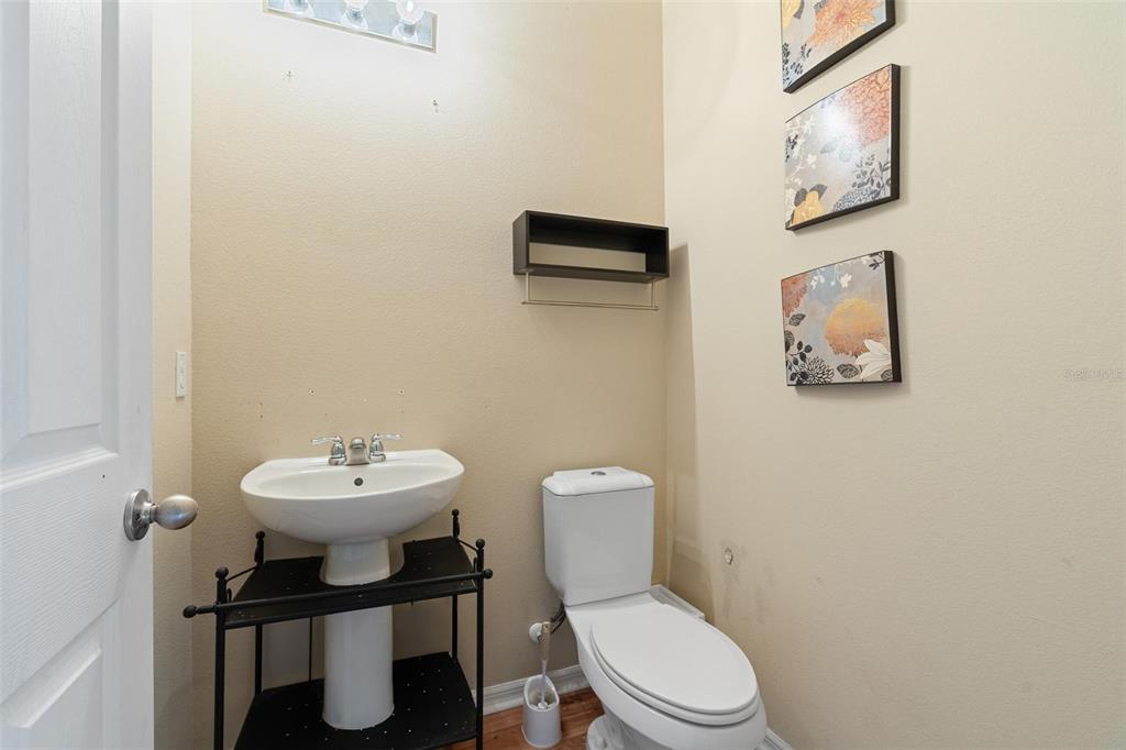 6799 Helmsley Circle Windermere, FL 34786 - Photo 20 of 61 a white toilet sitting next to a bathroom sink