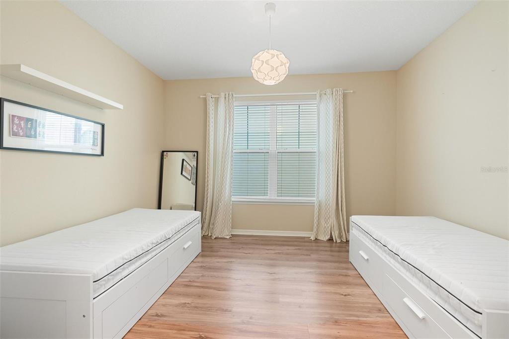 6799 Helmsley Circle Windermere, FL 34786 - Photo 26 of 61 a bedroom with a bed and a window
