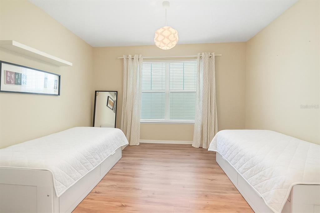 6799 Helmsley Circle Windermere, FL 34786 - Photo 27 of 61 a bedroom with a large bed and a window