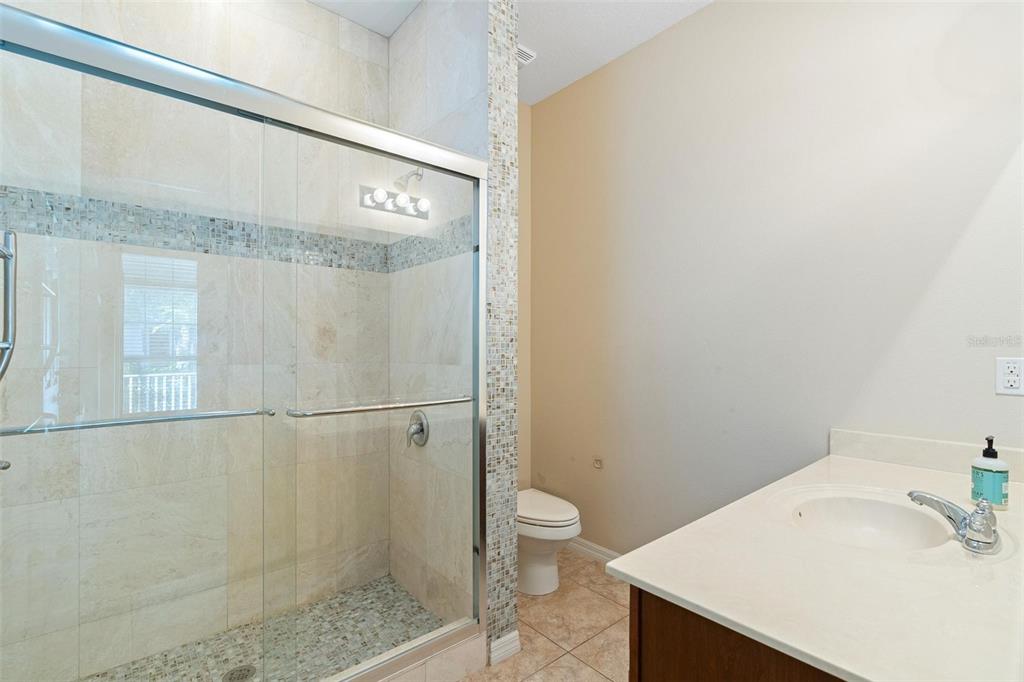 6799 Helmsley Circle Windermere, FL 34786 - Photo 33 of 61 a bathroom with a sink a toilet and shower