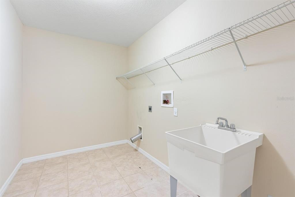 6799 Helmsley Circle Windermere, FL 34786 - Photo 40 of 61 a bathroom with a sink and vanity