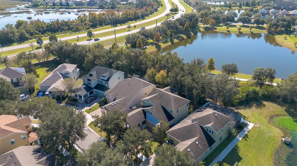 6799 Helmsley Circle Windermere, FL 34786 - Photo 50 of 61 an aerial view of house with yard and lake view