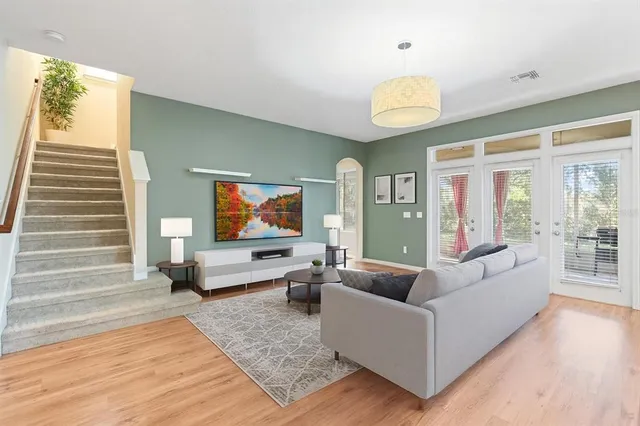 a living room with furniture and a large window