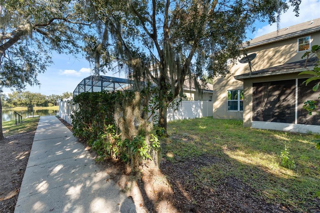 6799 Helmsley Circle Windermere, FL 34786 - Photo 56 of 61 a view of a yard with plants and trees