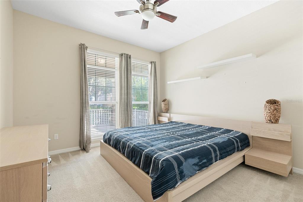 6799 Helmsley Circle Windermere, FL 34786 - Photo 6 of 61 a bedroom with a bed and window