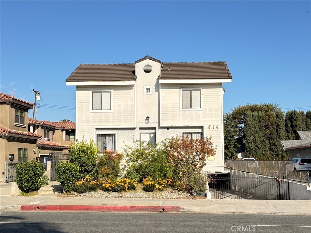 816 North Garfield Avenue, Unit B Alhambra, CA 91801 - Photo 2 of 12 a front view of a house with a yard