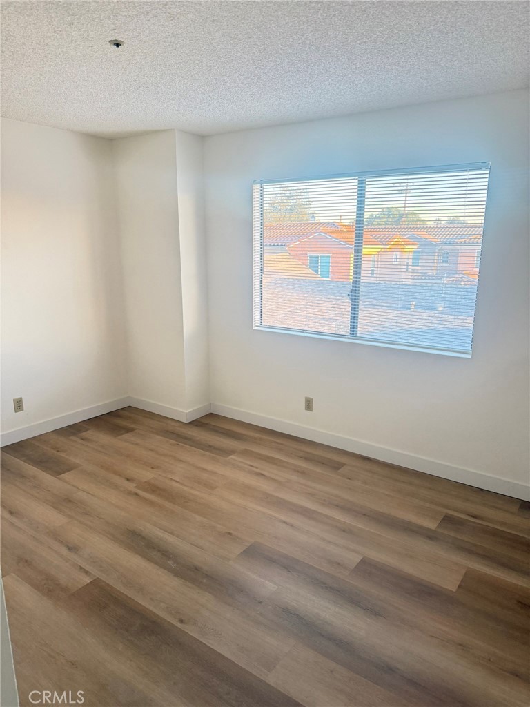 816 North Garfield Avenue, Unit B Alhambra, CA 91801 - Photo 4 of 12 wooden floor in an empty room with a window