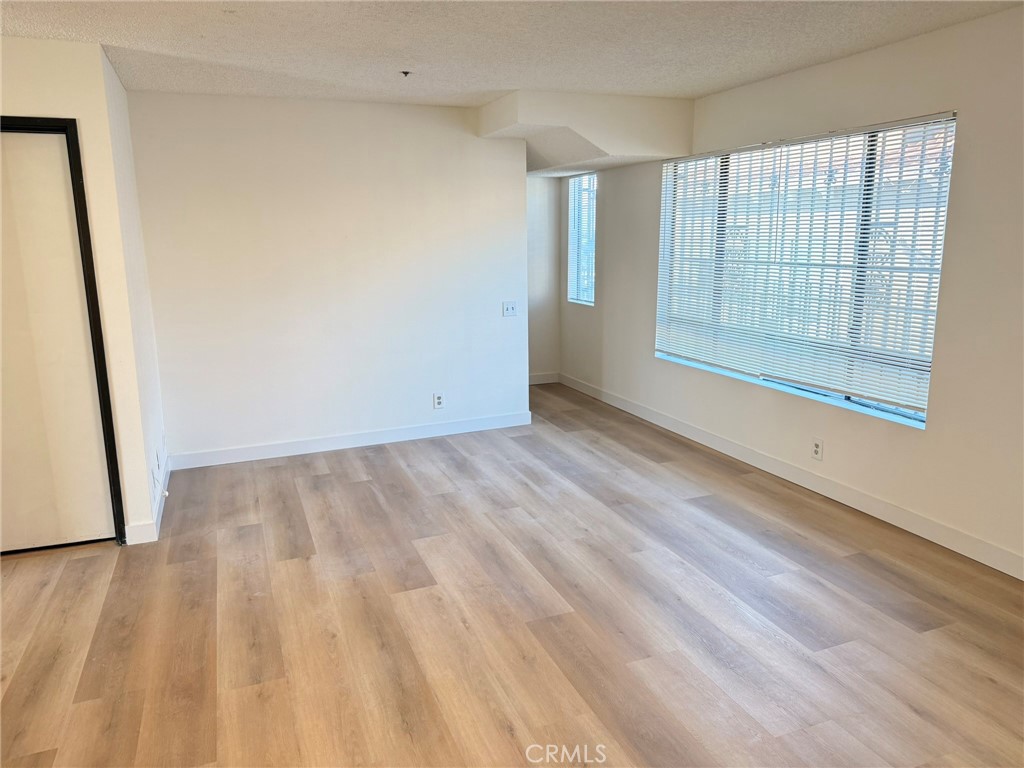 816 North Garfield Avenue, Unit B Alhambra, CA 91801 - Photo 8 of 12 wooden floor in an empty room with a window