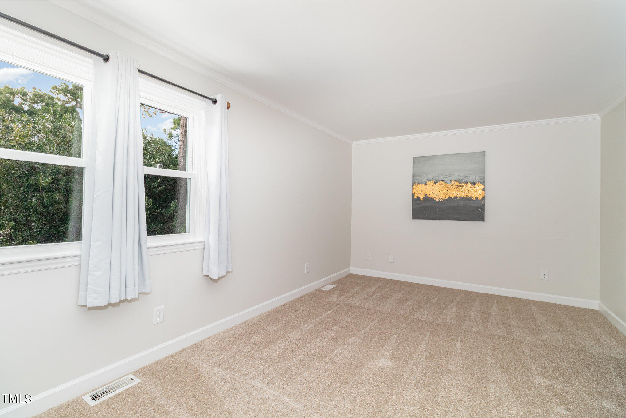 7050 Sandy Forks Road, Unit 101 Raleigh, NC 27615 - Photo 13 of 23 a view of an empty room with a window