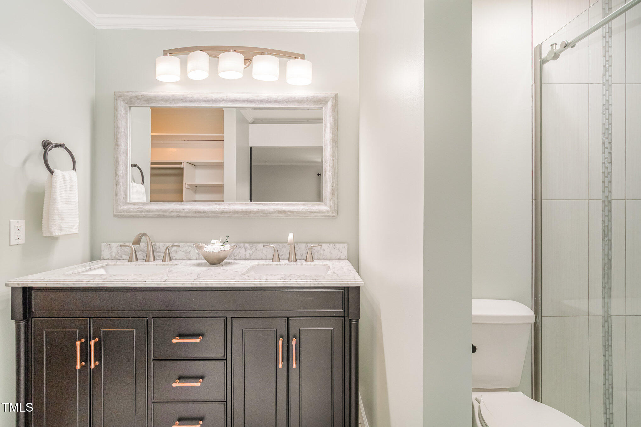 7050 Sandy Forks Road, Unit 101 Raleigh, NC 27615 - Photo 14 of 23 a bathroom with a sink and a mirror