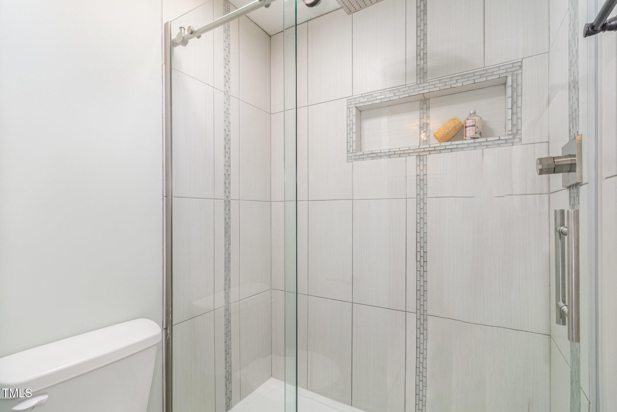 7050 Sandy Forks Road, Unit 101 Raleigh, NC 27615 - Photo 15 of 23 a bathroom with a shower