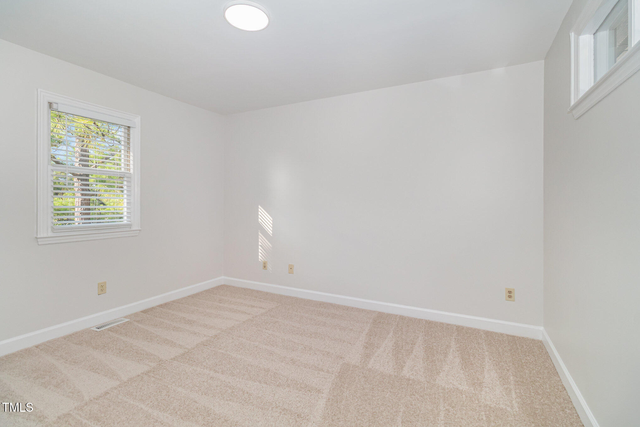 7050 Sandy Forks Road, Unit 101 Raleigh, NC 27615 - Photo 17 of 23 a view of an empty room with a window