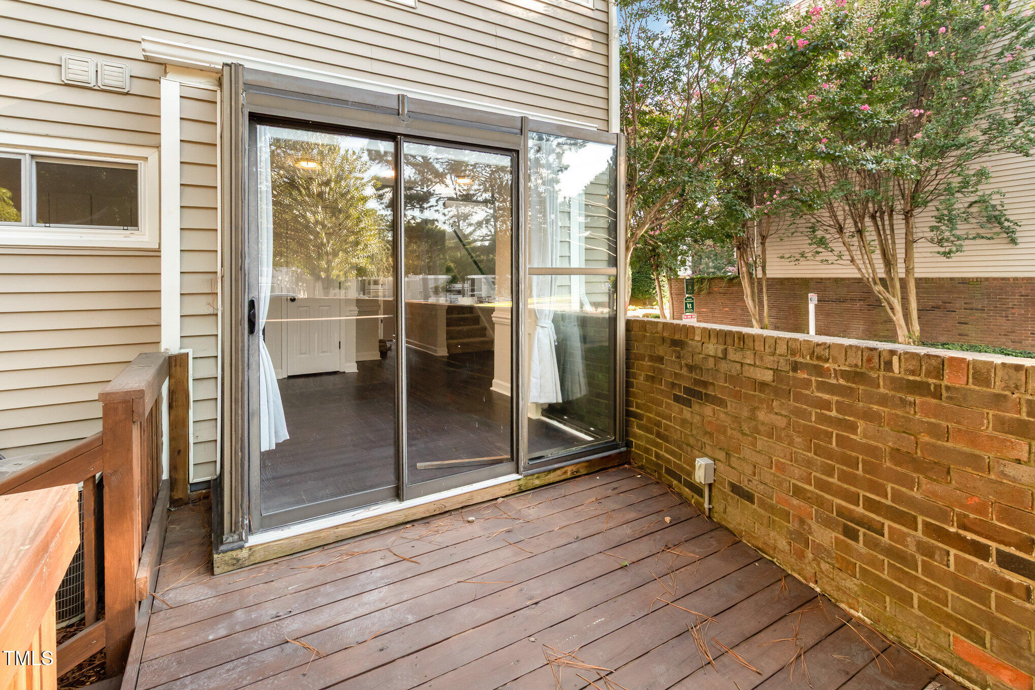 7050 Sandy Forks Road, Unit 101 Raleigh, NC 27615 - Photo 19 of 23 a view of a room with wooden floor and iron stairs