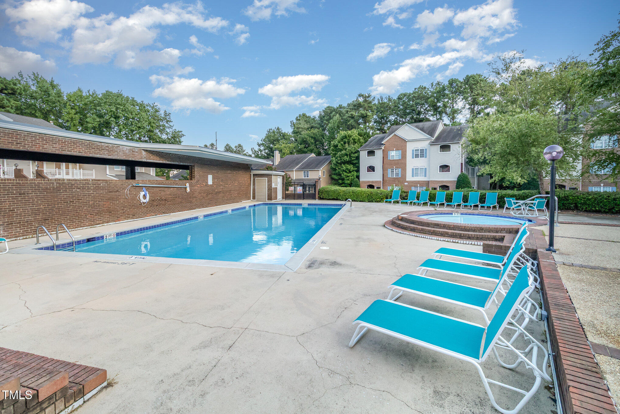 7050 Sandy Forks Road, Unit 101 Raleigh, NC 27615 - Photo 22 of 23 a view of a swimming pool with a terrace