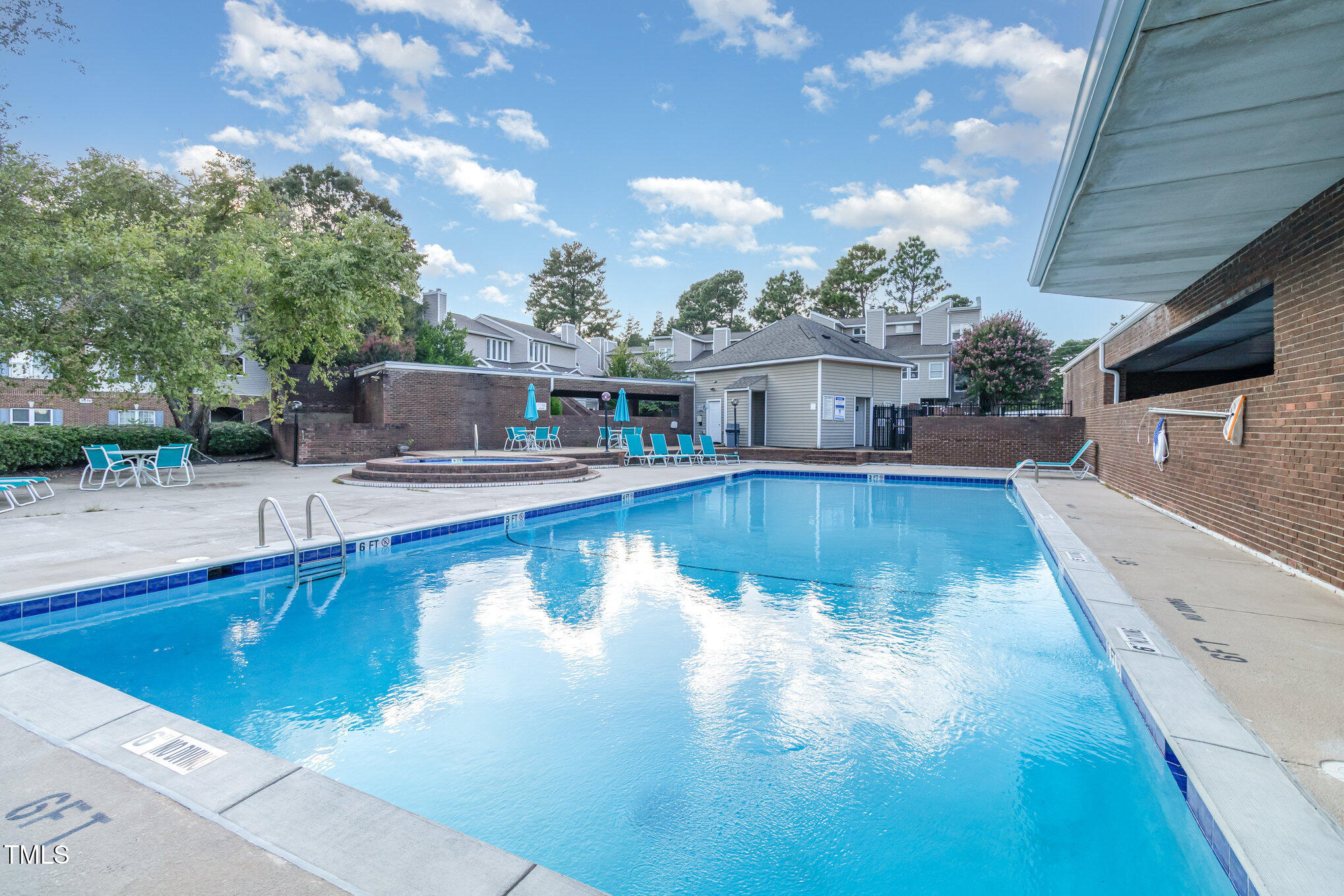 7050 Sandy Forks Road, Unit 101 Raleigh, NC 27615 - Photo 23 of 23 a view of a swimming pool with seating space