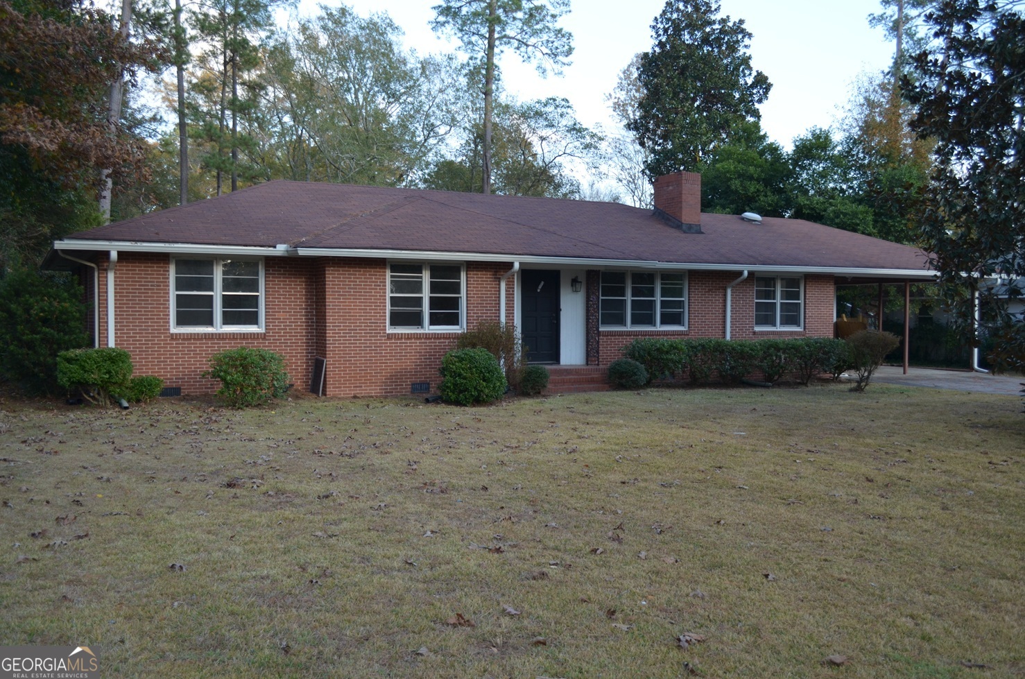 2655 Riverview Road Macon, GA 31204 - Photo 1 of 14 a front view of a house with a garden