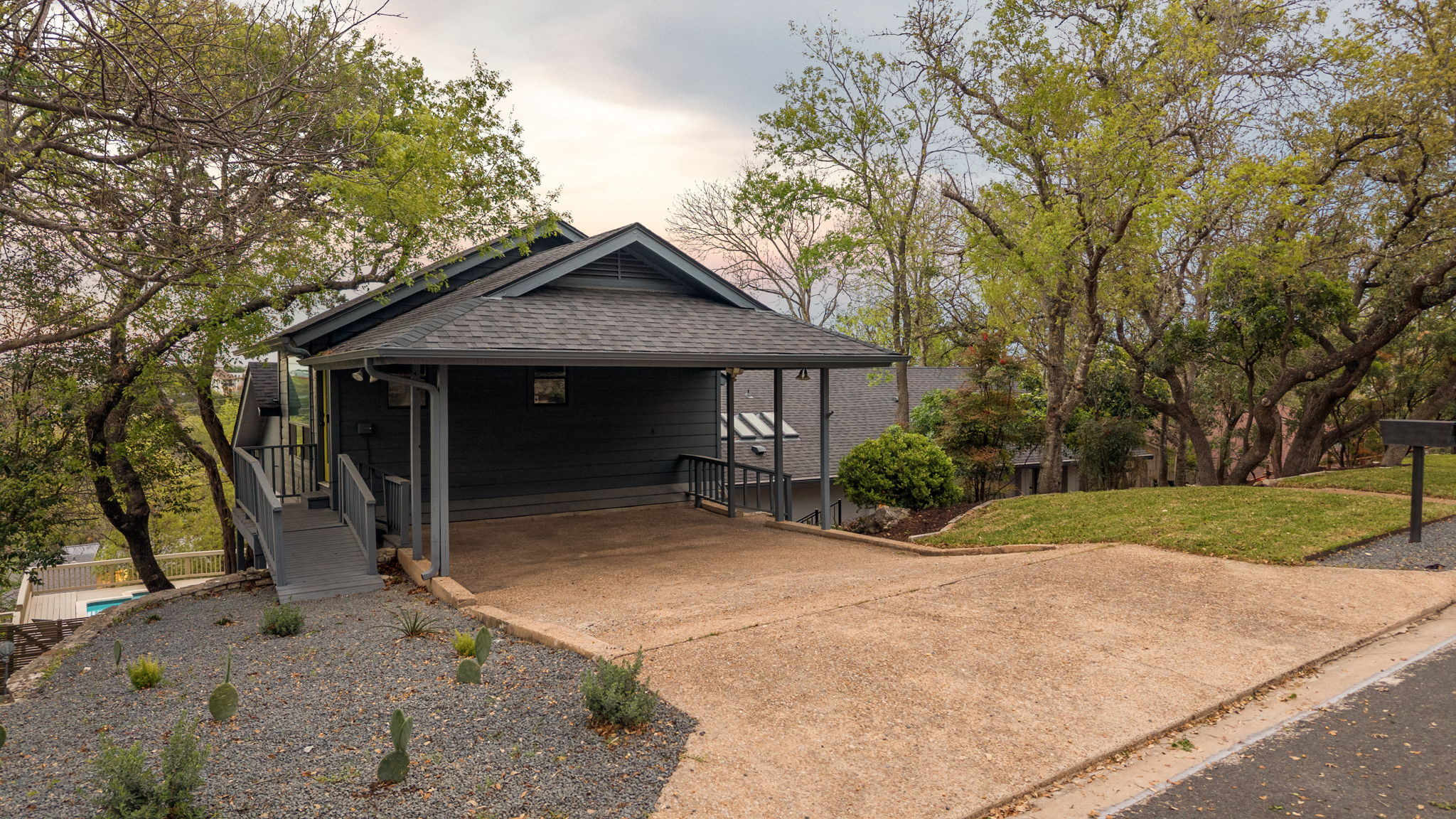 6501 Sumac Drive Austin, TX 78731 - Photo 35 of 40 View of front of house featuring concrete driveway, a front yard, a carport, and roof with shingles