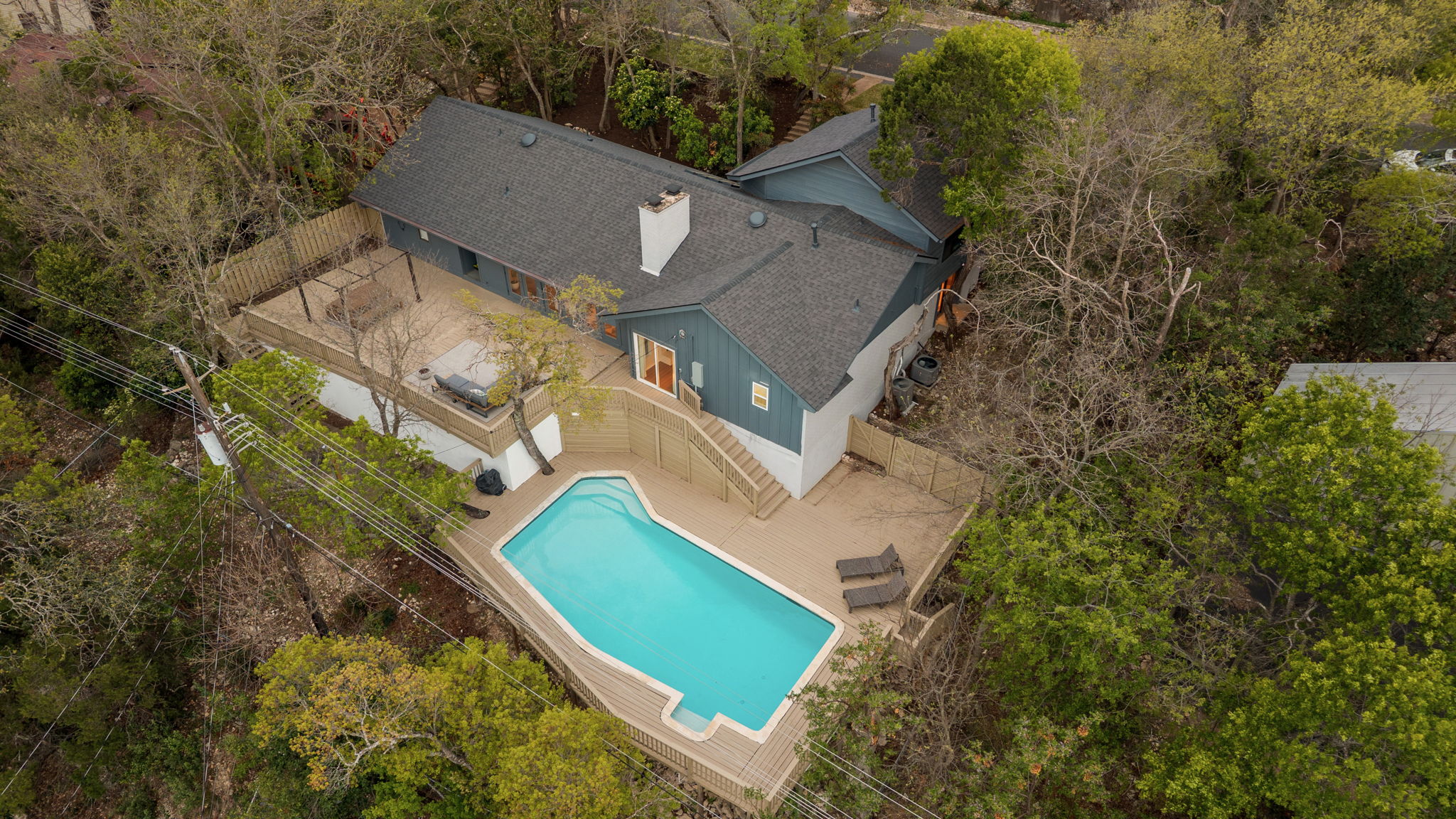 6501 Sumac Drive Austin, TX 78731 - Photo 36 of 40 Aerial view of property and surrounding area featuring a tree filled landscape and a pool area
