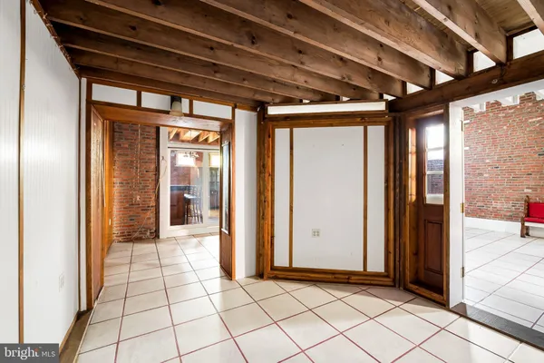 a large kitchen with stainless steel appliances granite countertop a stove and a refrigerator