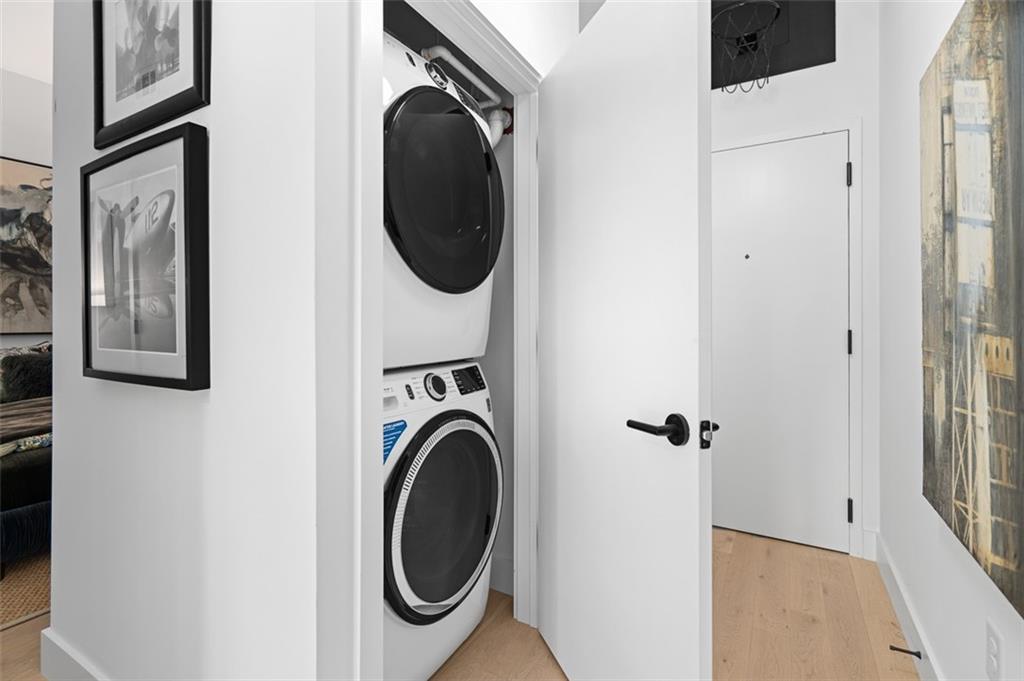 567 Ponce De Leon Avenue Northeast, Unit 405 Atlanta, GA 30308 - Photo 21 of 34 a view of a hallway with washer and dryer