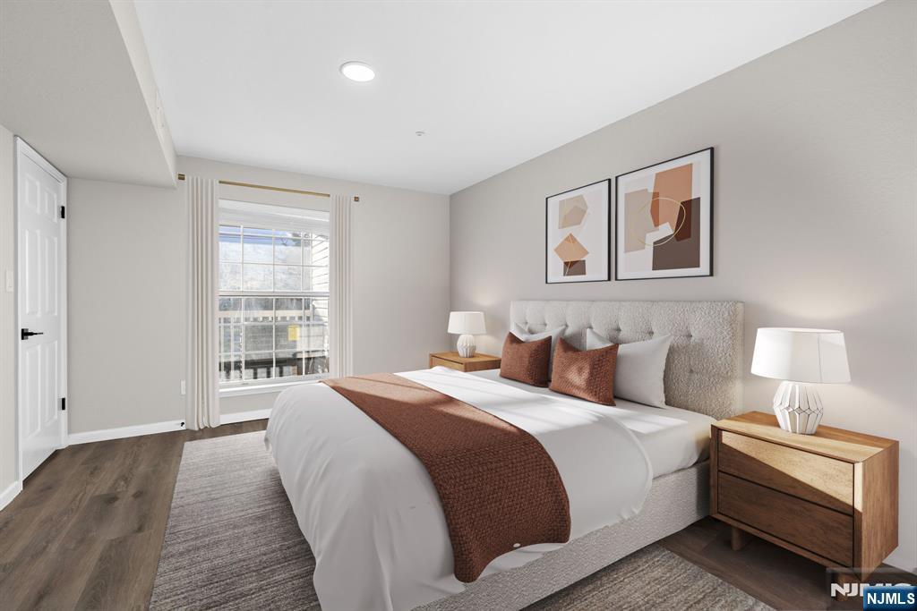 690 Rt 23 Wayne, NJ 07470 - Photo 6 of 11 a bedroom with bed and a window