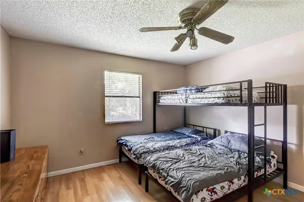 a bedroom with a bed and window