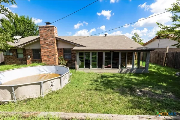 a front view of house with yard and porch