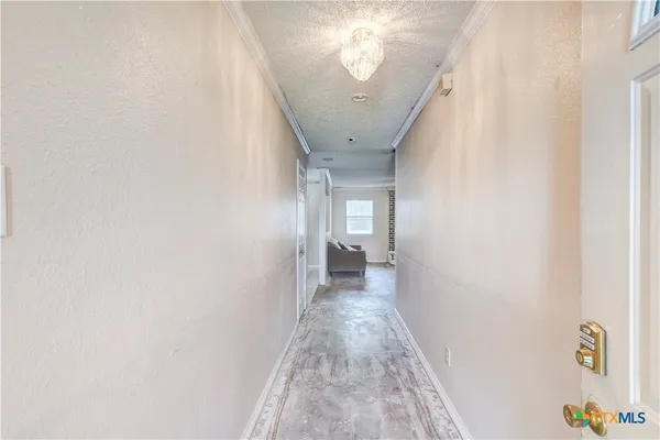 a view of a hallway with a white walls