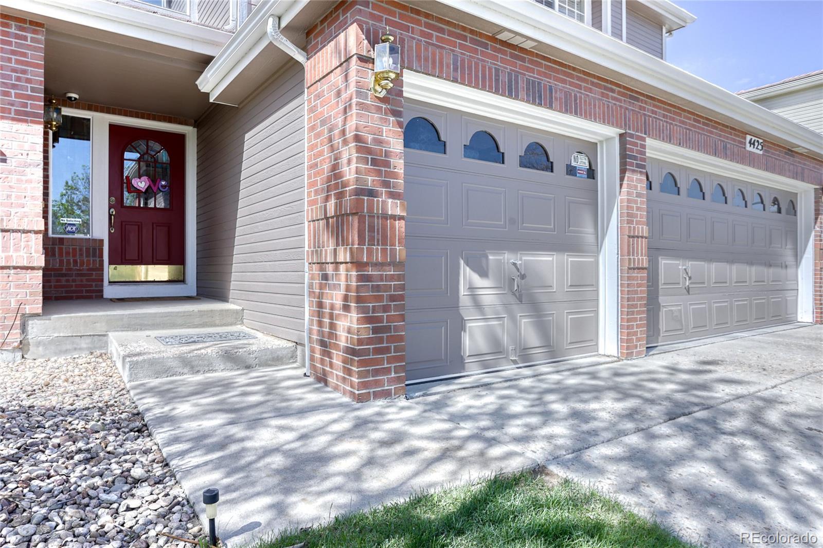 4425 Iran Street Denver, CO 80249 - Photo 2 of 36 a view of a house with backyard of the house